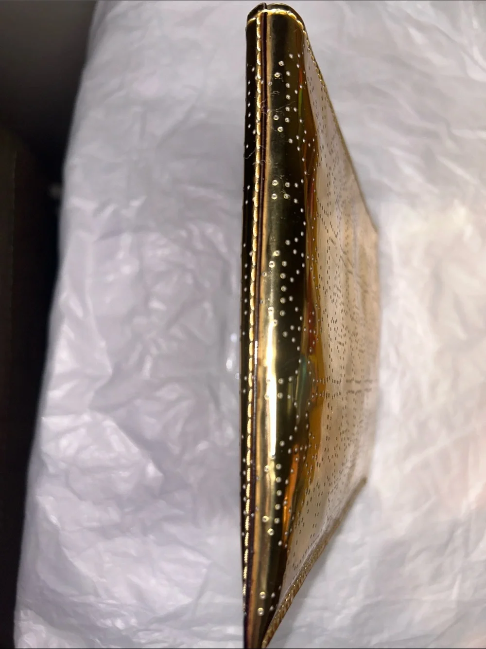 Kate Spade New York metallic gold pouch featuring a perforated spade pattern EUC